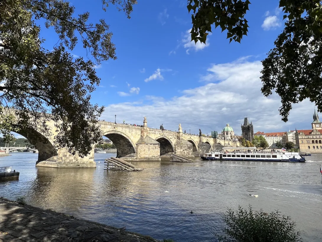 View of the charles bridge from the riverside on a beautiful day