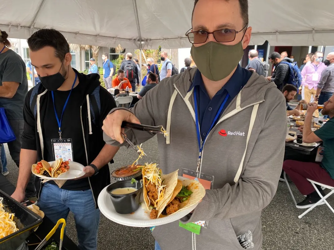 Attendee assembling tacos during lunch break