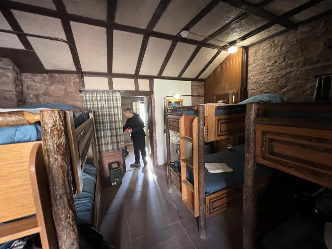 View of the inside of the cabin with lots of bunk beds