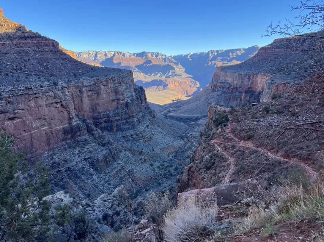 View of the canyon from the inside showing a long winding trail leading down