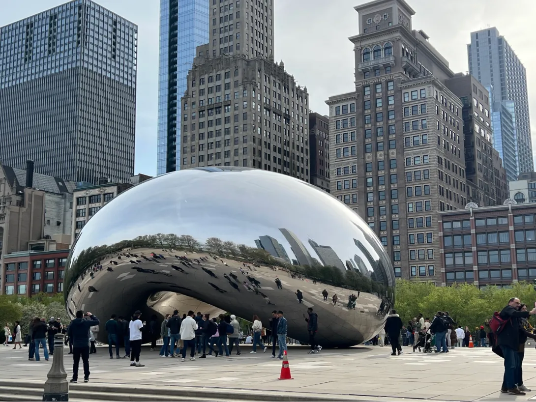 The large and shiny "bean" in front of skyscrapers