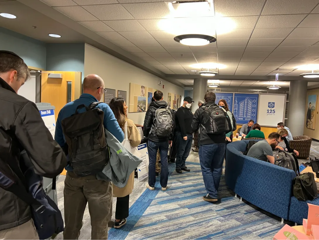 View of Midcamp registration with a large crowd of people in the lobby